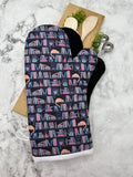 Oven Mitts. Books. Bookshelf Cat.