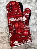 Oven mitts. Food. Soda. Pop. Coke