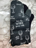 Oven mitts. Food. Wine glasses