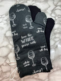 Oven mitts. Food. Wine glasses