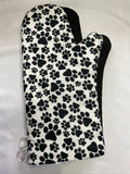 Oven mitts. Animals. Paw print on white