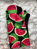 Oven mitts. Food. Watermelon