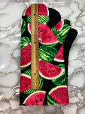 Oven mitts. Food. Watermelon
