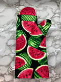Oven mitts. Food. Watermelon