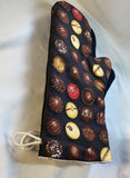 Oven mitts. Food. Chocolate truffles