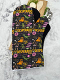 Oven Mitts. Pop Culture. Dungeon Crawler Carl. Desperado Club