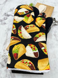 Oven mitts. Food. Tacos. Large print.