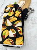 Oven mitts. Food. Tacos. Large print.