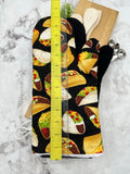 Oven mitts. Food. Tacos. Large print.
