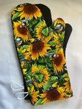 Oven mitts. Flowers. Sunflowers and blue birds.
