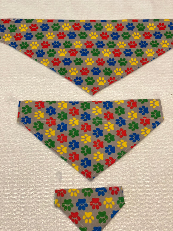 Paws Dog bandanas. Grey with multi coloured paws. Small, medium, large, fits ON the collar!
