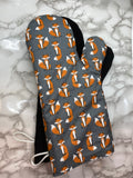 Oven mitts. Animals. Foxes on grey