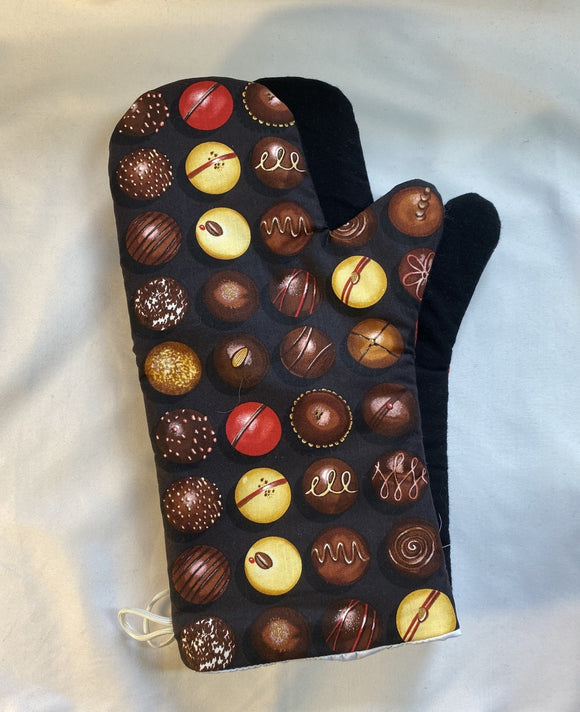 Oven mitts. Food. Chocolate truffles.